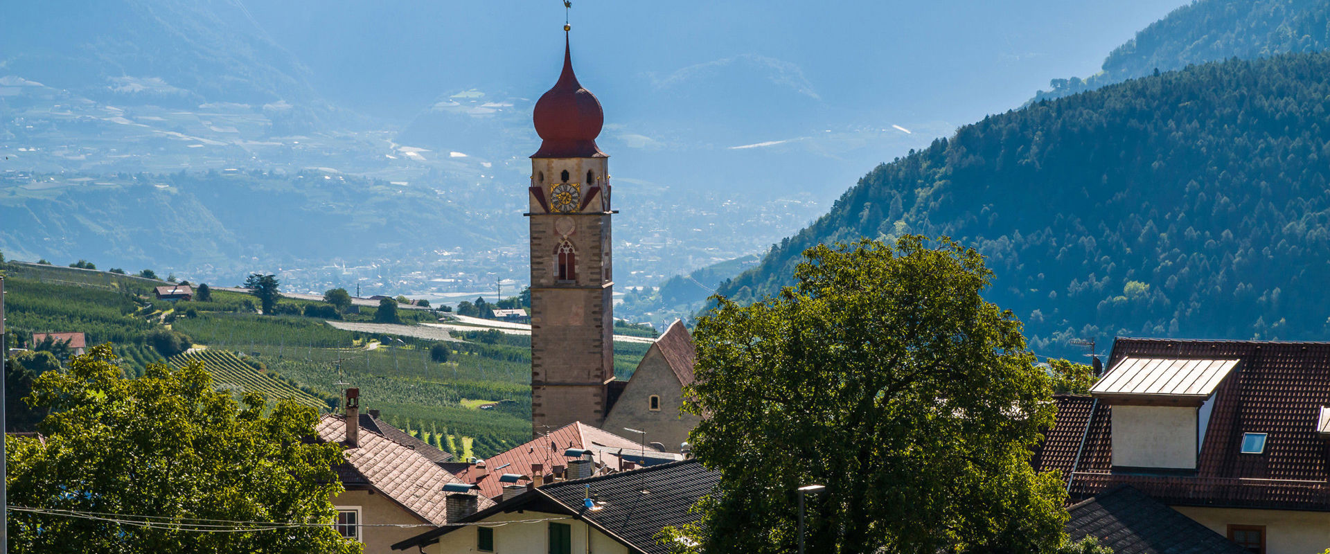 Parish church of St. Peter and Paul in Partschins The parish church of St. Peter and Paul in Partschins with surrounding mountain landscape.